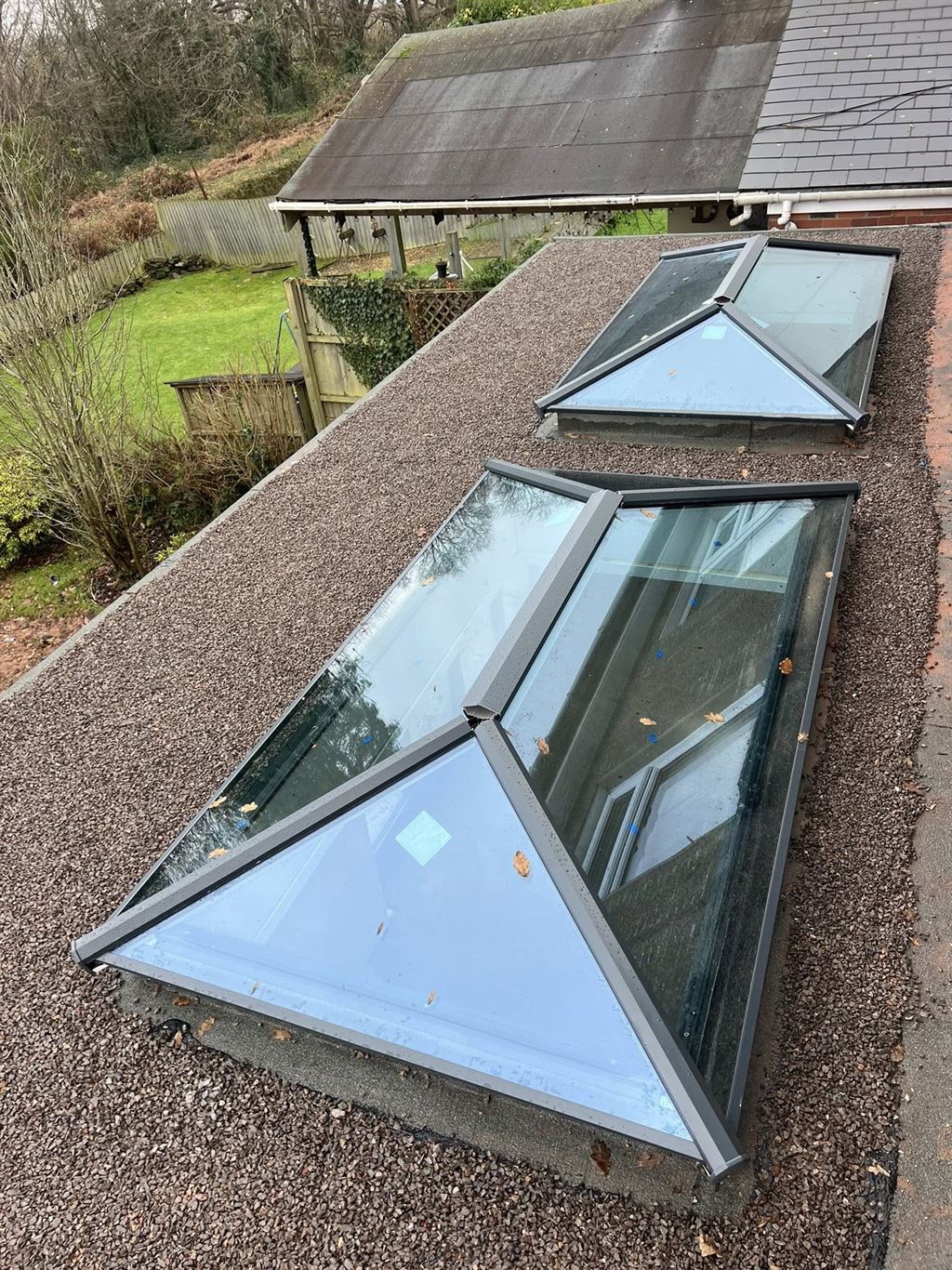 Twin anthracite roof lanterns on an orangery extension